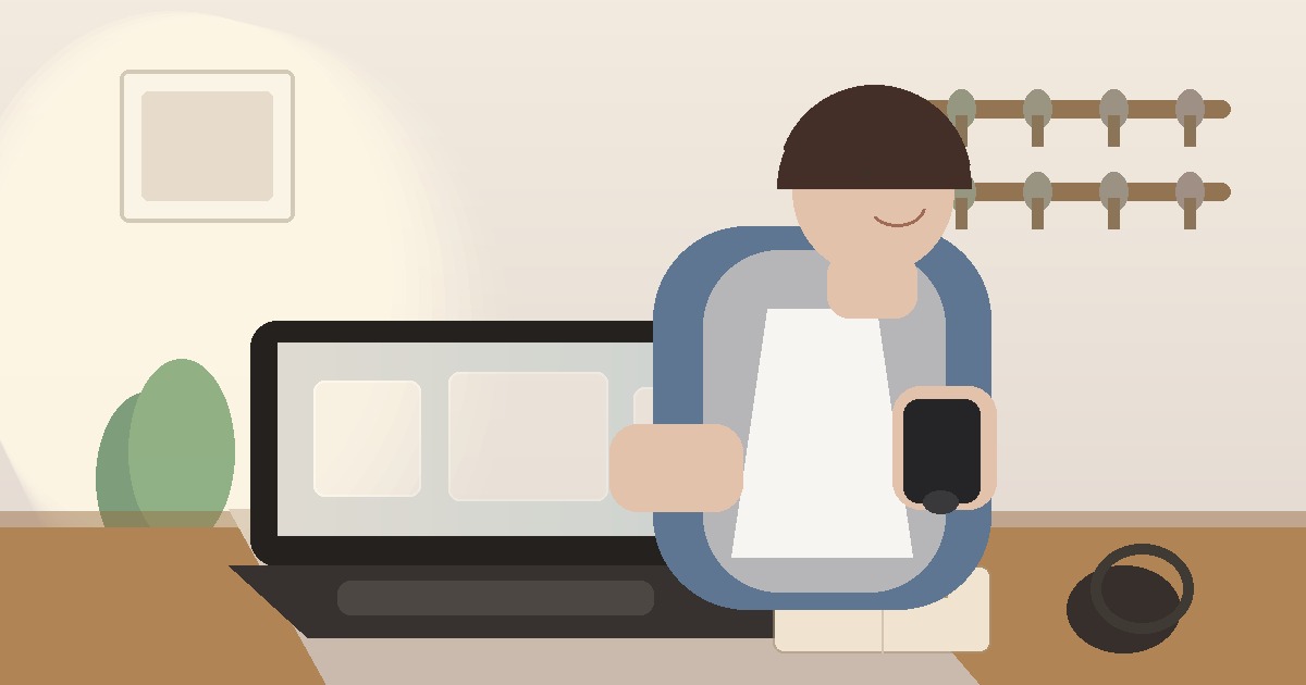 A small business owner comparing options on a laptop and phone in a calm workspace